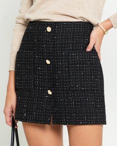 Product Details Elevate your style with the Renni Mini Skirt. Crafted from luxurious tweed material, this high-waisted skirt features front gold button details for a chic touch. - Front pockets- Back zipper- Lined- Content: Fabric: 80% Acrylic, 20% Wool; Lining: 100% Polyester- Care: Wash cold + dry flat Style# C24WSKH0460G Fit Notes - Model wearing a size S - Model measurements: 5'10'' Height / 32'' Bust / 24'' Waist / 34'' Hips- Garment measurements: Size Length Waist XS 40 69.9 S 40.6 74.9 M Winter Mini Skirts, Black Tweed Skirt, Aesthetic Office, Tweed Material, Quilted Skirt, Black Tweed, Classy Fashion, Tweed Skirt, Linen Shop