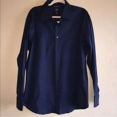 New Nwt Mens Navy Blue Long Sleeve Button Up Career Work Professional Casual Shirt Color Shade May Vary Or Be Slightly Lighter Or Darker Depending On Compuetr/Phone Screen Being Used Size Xl 17-17.5 It Was Hard To Capture The Color Of This Shirt, It Is A True Dark Navy Blue, See The Last Picture To See The More Accurate Color Measurements Are In The Comments Please Feel Free To Contact Me With Any Questions Or Concerns Navy Button-up Business Tops, Gap Tops With Button Closure And Spread Collar, Gap Top With Button Closure And Spread Collar, Classic Gap Shirt With Button Closure, Classic Gap Shirt With Buttons, Blue Button-up Business Top, Classic Collared Gap Shirt, Blue Business Top With Button Closure, Gap Blue Long Sleeve Shirt