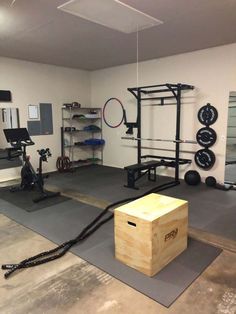 an empty gym with equipment and exercise mats