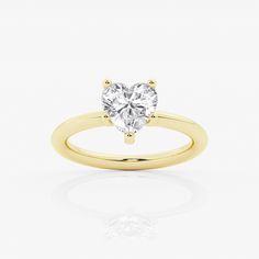 a heart shaped diamond ring on a white background