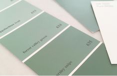 some green and white paint swatches on top of each other with the same color