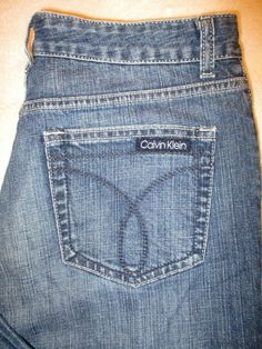 Calvin Klein Relaxed Boot Stretch Women's Jeans Size 12 , Style #WF39A91 Condition:  In good condition.  Nice medium blue whiskered wash.    These would look great paired with one of our shirts - check them out! Style Name/Style #: Relaxed Boot Size Tag Reads: 12 Waist: 33” with waist aligned Hips:   40" Rise:   10 1/2” Inseam: 30" Leg opening at bottom:  10"    &nbsp Casual Calvin Klein Jeans For Spring, Calvin Klein Medium Wash Casual Jeans, Casual Calvin Klein Medium Wash Jeans, Casual Mid-rise Calvin Klein Jeans, Casual Calvin Klein Mid-rise Jeans, Casual Mid-rise Jeans By Calvin Klein, Hip Alignment, Calvin Klein Casual Mid-rise Jeans, Calvin Klein Blue Cotton Bottoms