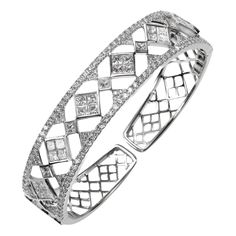 Elegant princess cut diamond cuff bangle bracelet in 18k white gold. Bracelet contains 31 princess cut diamonds, 3.96tcw and round brilliant diamonds, 2.01tcw. Diamonds are F-G in color and VS in clarity, excellent cut. Princess cut diamonds are mounted in an invisible bezel setting. Bracelet has a hinged opening for convenient wearability and security. All of our pieces are packaged carefully and accompanied by a Pico box to keep your jewelry item safe. A complimentary appraisal can be sent aft Gold For Sale, Bracelet Love, Cuff Bangle Bracelet, Princess Cut Diamond, White Gold Bracelet, Diamond Bangle, Bangle Set, Princess Cut Diamonds, Cuff Bangles