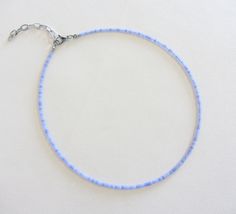 Cornflower blue seed beads choker necklace, Long dainty beaded necklaces, Tiny choker, 14k gold jewelry for her There are two clasp options, one is a stainless steel clasp and chain, the second option the clasp and chain are made of brass with 14k gold plating so the necklace will not lose its look over time! Measure the length of your neck with a measuring tape or you can use any thread, rope, or cable for telephone and after apply the measurements to a regular ruler. Choker is 12 inches with a 2 inches adjustable extender chain. 14 inches full length. The necklace is made using size 10/0 Czech beads (approximately 2.3mm.) Tiny Seed Bead Jewelry, Beads Choker Necklace, Beads Choker, Second Option, Bracelet Ideas, Beaded Choker Necklace, Necklace Long, Measuring Tape, Jewelry For Her