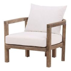 a wooden chair with white pillows on it