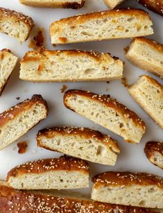 several pieces of bread on a plate with sesame seeds