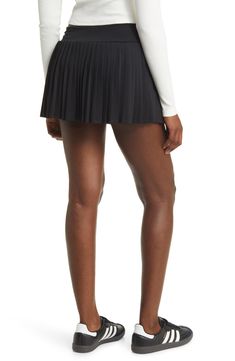 Allover pleats lend swingy movement to this sporty skort designed with a wide, smoothing waistband. 12" length Lined 92% polyester, 8% spandex Machine wash, line dry Imported