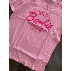 Come On Barbie Lets Go Party T-Shirt Women's Large Pink Short Sleeve Pullover Description Come On Barbie Lets Go Party T-Shirt Women's Large Pink Short Sleeve Pullover. Product Detail Brand: Barbie Department: Women's Color: Pink Type: T-Shirt Please Message Me If You Have Any Questions. Please Check Photos Above For Measurements. Fun Crew Neck Top With Logo Print, Come On Barbie Lets Go Party Shirt, Plus Size Barbie T Shirt, Barbie Tshirt Women, Pink Short Sleeve T-shirt For Bachelorette Party, Pink Personalized Short Sleeve T-shirt, Barbie Silhouette, Boxy Crop Top, Barbie Logo