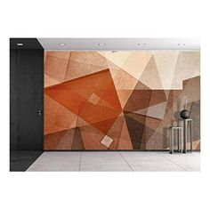 an orange and brown abstract wall mural in a room