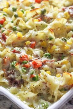 a casserole dish filled with pasta and vegetables