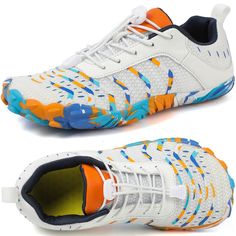 a pair of white shoes with blue and orange accents on the upper part of the shoe