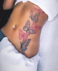 a woman's stomach with butterflies on it