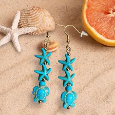 Are you in a beach mood? Our turtle and starfish earrings are fun and unique and make you feel like summer on any occasion. The turquoise pair has nickel-free ear hooks and the coral pair has 18K gold plated ear hooks, both are good for anyone with sensitivities to some metals. The earrings are light weight and comfortable to wear all day. Your earrings will arrive in a silver gift box tied with a colorful fabric ribbon for easy gift giving. To see more jewelry and gifts in our Etsy shop, please Blue Star Jewelry For Vacation, Blue Star Shaped Jewelry For Vacation, Summer Star-shaped Jewelry For Pierced Ears, Summer Vacation Starfish Jewelry, Summer Earrings With Starfish Charm, Turquoise Jewelry With Starfish Charm For Vacation, Blue Earrings For Summer Beach Occasion, Turquoise Bohemian Earrings For Beach, Blue Earrings For Vacation