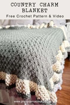 a crocheted blanket on top of a bed with text overlay that reads country charm blanket free crochet pattern and video