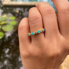 Material: 14k/18k goldColor Options: Yellow Gold, White Gold, Rose GoldStone:Natural Turquoise, RoundSize: 2.8 mm * 4 Nos.Approx Weight (Ct): 0.352Accent Stones: Diamond RoundSize: 1.8 mm * 5 Nos.Approx Weight (Ct): 0.125 Turquoise Birthstone Ring With Accent Stones, Turquoise Rings With Bezel Setting In Fine Jewelry Style, Anniversary Turquoise Ring With Gemstone Accents, Turquoise Rings With Bezel Setting, Turquoise Gemstone Stackable Rings, Turquoise Opal Birthstone Ring, Stackable Round Turquoise Ring In Blue, Blue Turquoise Stackable Round Ring, Turquoise Ring With Bezel Setting