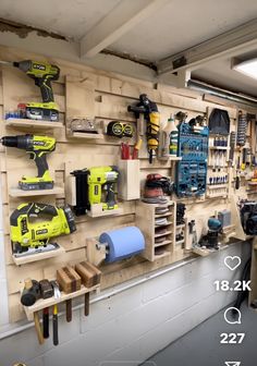 a room filled with lots of tools and shelves full of work supplies on the wall