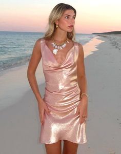 Metallic rose gold silk lamé cowl neck dress. Cowl neckline Low back with V-straps  Italian metallic lamé fabric  Fits close to body with flounce bottom Made in Italy  Fabric content: 85% silk, 15% metallic lurex Care instructions: dry clean only Fit: model is 5'9 and wears a size XS. Size S measurements: Length from shoulder: 35" Complete the look: Sequin Flower Tie  Final Sale Rose Gold Slip Dress, Rose Gold Silk Dress, Gold Rose Dress, Silk Cowl Neck Dress, Lamé Fabric, Siren Dress, Silk Organza Dress, Bow Bandeau, Eden Dress