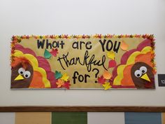 a bulletin board that says, who are you grateful for? with two turkeys on it