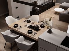 an overhead view of a dining room table with chairs and place settings on the table