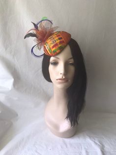 Looking for a African styled fascinator? This is an Ankara fascinator hat with orange, burgundy and touches of green, perfect for weddings, tea party, church hat, Kentucky derby hat or any other special occasions. Handmade and wrap with beautiful African print fabric and adorned with feathers and burnt orange with gold specs mesh. EASY TO WEAR Design to fit to the curve of the head and is flexible to bend and customized to your unique shape head. As with most of my headpieces, this hat can be wo Adjustable Multicolor Headwrap For Party, Fitted Multicolor Headband Headpiece, Fitted Multicolor Headband, Adjustable Multicolor Headpiece For Royal Ascot, Adjustable Multicolor Fascinator For Carnival, Fitted Multicolor Hat For Carnival, Traditional Multicolor Party Hats, Multicolor Carnival Mini Hat Headband, Multicolor Adjustable Fascinator Hat