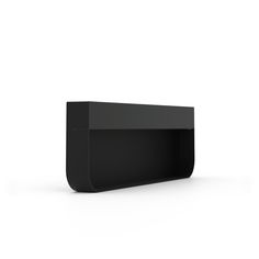 a black shelf sitting on top of a white wall