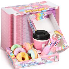 a pink box filled with donuts and other items