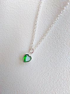 "Sterling Silver necklace with emerald. Size shown is 16\". Please choose your favorite necklace length at checkout. All lengths have a one inch extender, that way you'll have some wiggle room to play with the length. For example, if you choose a 14 inches necklace length, you'll have options to close the necklace at any length between 14 inches and 15 inches. Some of this charms are sold by themselves (no chain). If that option is available for this, you will have the option to buy \"CHARM ONLY Argentium Silver Jewelry, Green Pendant, Green Pendants, Big Rings, Necklace Green, Necklace Heart, Emerald Necklace, Argentium Silver, Gift For Girlfriend