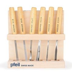 a set of knives in a wooden holder