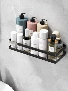 a bathroom shelf filled with lots of different types of soaps and lotion bottles