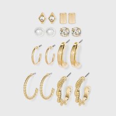 Polish off your outfits with the glam appeal of this 8-Piece Multi Gold Hoops and Cubic Zirconia Stud Earring Set from A New Day™. This eight-piece earring set includes stud earrings ranging from simple to pearl to twisted and more to make them suitable for a range of occasions. Whether worn alone or paired with other accessories, this stud and hoop earring set will add a perfect finishing touch to your looks. Target Earrings, Dr Accessories, Teen Earrings, Hoop Earring Set, Earring Sets, Xmas List, Nickel Free Earrings, Bar Studs, Ear Cuff Earings