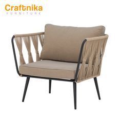 an image of a chair that is made out of rattan and wood with a beige cushion