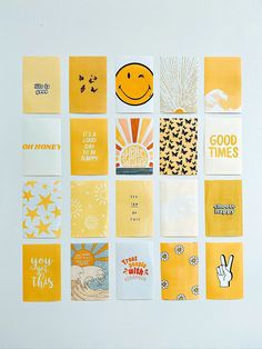 many different yellow and white greeting cards are arranged on a wall with the words good times written below them