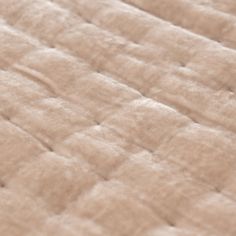 the texture of an unmade mattress is shown in this close up photo, with no sheets on it