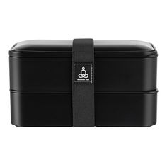 Take lunches to work with our Bento Tek 41-ounce Black Buddha Box All-In-One Lunch Box. Featuring two stackable containers, this Japanese bento box allows you to easily pack two meals in a space-saving way. With an included fork, spoon, and knife, this modern lunch box has a special compartment specially designed for these utensils to prevent them from being loose in your lunch bag. The sauce and snack cup of this Japanese portable lunch box provide a convenient way to take condiments or desserts. This bento box is microwavable, allowing you to quickly heat up your lunch in the breakroom or cafeteria. To avoid hand washing each container, this Japanese lunch container can be cleaned in the dishwasher. This bento lunch box for adults measures 7.25 inches long by 4.25 inches wide by 4 inches Modern Lunch Boxes, Black Buddha, Japanese Bento Box, Japanese Lunch, Washable Paper Bag, Japanese Bento, Soup Containers, Snack Cups, Snack Jars