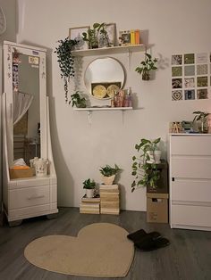 a living room filled with furniture and lots of plants on top of shelves next to a mirror