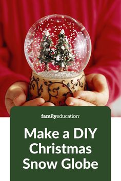 a person holding a snow globe in their hands with the words make a diy christmas snow globe