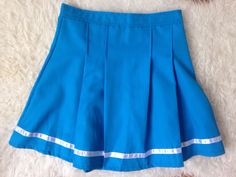 Vintage Pleated Mini Skirt | Tennis Skirt | 90s Mini Skirt | 80s Blue Mini Skirt | Sports Skirt | Activewear Skirt | Preppy Grunge Skirt |s | cheerleader skirt  1980s cheerleader sporty, bright blue mini skirt with a reflective stripe at the bottom.  Great condition, no noticeable flaws. Size: about an S/M Small / Medium US 2 - 6 or UK 6- 10 depending whether to wear it higher on the waist or lower at the hips. Measurements laid flat at the waist: 13.5 in. So waist would be 27 in. Max. PLEASE  N Cheap Y2k Style Blue Skirt, Blue Pleated Tennis Skirt For School, Blue Stretch Skort For School, Blue Pleated Skirt For School, Fitted Blue Skort For Cheerleading, Retro School Mini Skirt With Lining, Retro School Skort With Lined Skirt, Retro Blue Fitted Skort, Blue School Uniform Tennis Skirt