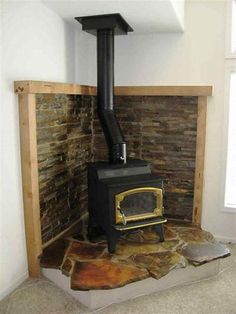 a wood burning stove sitting inside of a room