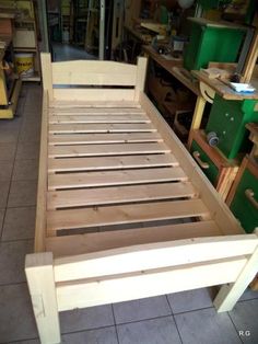 a bed frame made out of wood in a shop