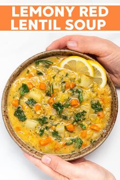 two hands holding a bowl of lemony red lentil soup