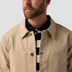 When it's too hot for a puffy and too cold for a tee, we throw on our Stoic Workwear Chore Coat. The buttoned closure and vintage vibe keep our casual 'fit slightly elevated, while the plethora of pockets frees up our hands. Casual Beige Tops With Snap Buttons, Casual Khaki Tops With Buttoned Pockets, Everyday Cotton Outerwear With Double-needle Sleeve, Casual Outdoor Outerwear With Buttoned Pockets, Winter Cotton Tops With Buttoned Pockets, Casual Beige Tops For Outdoor, Retro Cotton Outerwear For Outdoor, Retro Cotton Outdoor Outerwear, Unstructured Cotton Outerwear For Streetwear