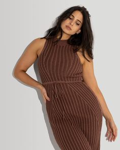 If you are looking for a versatile addition to your wardrobe, this is the piece! Knit using Pima cotton in Peru, this dress is super soft and easy to wear. Whether paired with sneakers for a casual weekend look, or dressed up with heels for a night out, this dress is sure to turn heads. The two tone Maroon and Toffee yarn has a monochrome effect that highlights the beauty of the yarn and rib stitch. The cord at the waist can be adjusted to accommodate the desired comfort and fit. Fall Knit Mini Dress With V-neck, Textured Knit V-neck Dress, Brown Ribbed Knit Dress, Two Tone Dress, Brown Ribbed V-neck Dress, Fitted Brown Sweater Dress With V-neck, Rib Stitch, Casual Weekend, Pima Cotton