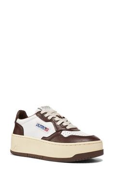 Cool throwback style is the name of the game with this '80s-inspired sneaker complete with a padded collar and a logo label stitched on the tongue. Lace-up style Removable, cushioned insole with arch support Leather upper/leather and textile lining/rubber sole Imported Low-top Brown Sneakers With Logo, Brown Low-top Sneakers With Logo, Retro Brown Sneakers For Streetwear, Classic Low-top Sneakers With Logo Patch, Brown Sporty Sneakers With Logo, Sporty Brown Sneakers With Logo, Brown Low-top Sneakers With Embroidered Logo, Brown Sneakers With Embroidered Logo For Streetwear, Retro High-top Sneakers With Contrast Sole