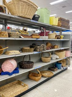 baskets are lined up on shelves in a store