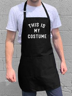 a man wearing an apron with the words i love my wife printed in white on it