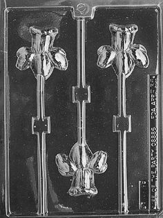 chocolate candy mold with flowers and leaves on the front, shown in black and white