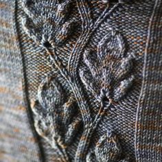 close up view of the stitchs and details on a sweater that is knitted