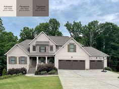 a large house with two garages in front of it