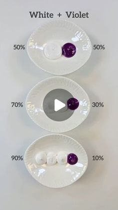 three white plates with purple and white buttons on them, labeled in the words white + violett