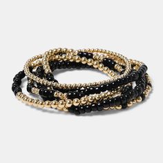 Discover the Black Truffle Stack Bracelets—your new neutral fav! 🌟 This chic stack features black glass beads paired with 14K gold-filled accents, offering a touch of luxe that complements any outfit. Choose between stacks of 3 or 6 bracelets for endless mixing and matching possibilities. Elevate your arm candy with this elegant and versatile set! You can never have too much arm candy! ✨ Classic Black Stackable Jewelry, Everyday Gold Bracelet With Black Beads, Elegant Gold Bracelets With Black Beads, Black Stack Bracelets, Black Stackable Bangle Jewelry, Elegant Black Stackable Bracelets, Elegant Black Stackable Beaded Bracelets, Black Stackable Bracelet, Bohemian Black Stackable Stretch Bracelet